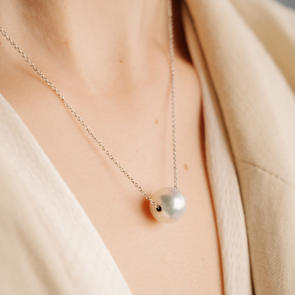 This oscillating classic, the Drifting Pearl Necklace, features a Cygnet Bay (WA) grown 10.5mm Round A3 grade Australian South Sea pearl that’s sealed with gold, set on an adjustable 45cm gold chain and parrot clasp.