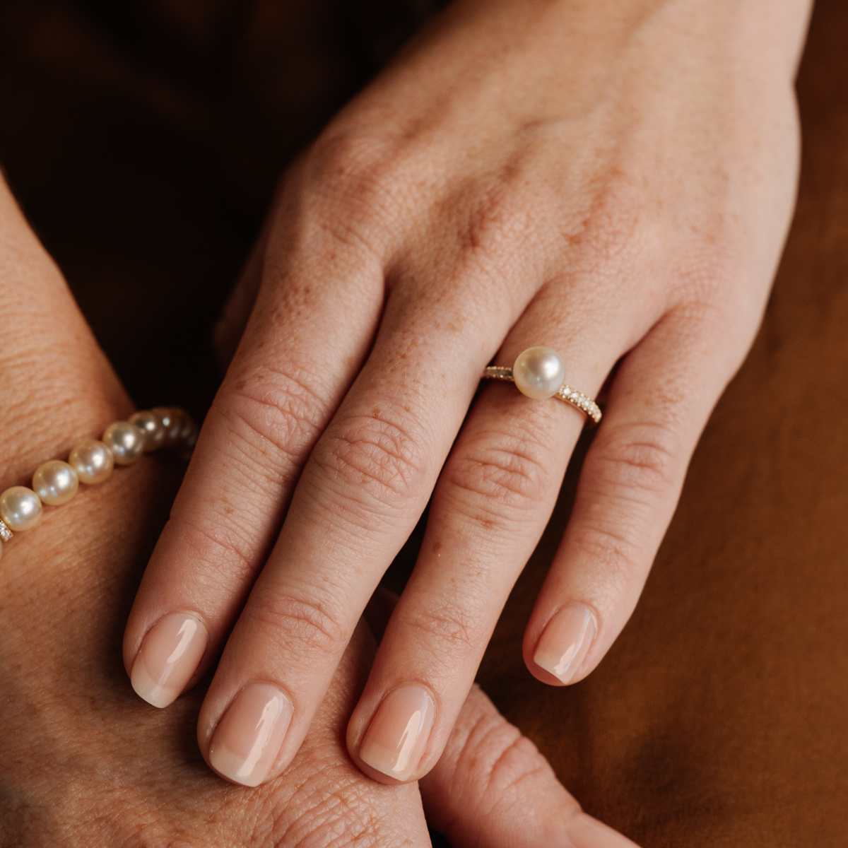 This Eternal Petite Diamond &amp; South Sea Pearl Ring features a Cygnet Bay (WA) grown 9mm Round A3 grade Australian South Sea pearl set on a band with a row of 18 White Diamonds (0.18ct H/SI) in 9ct gold.