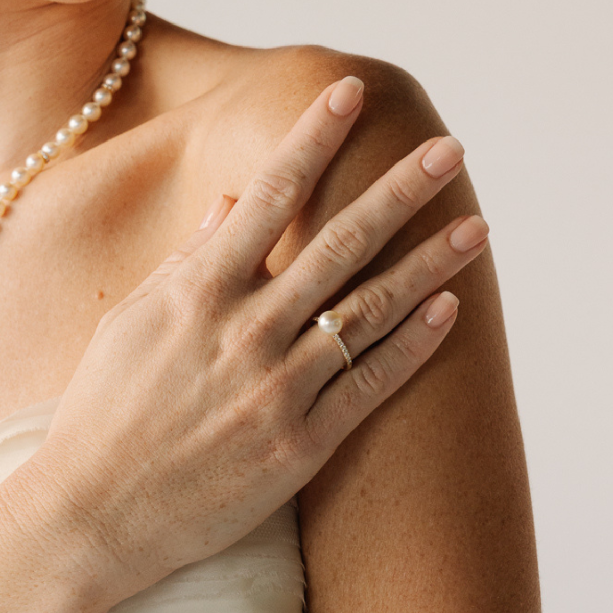 This Eternal Petite Diamond &amp; Akoya Pearl Ring features a Broken Bay (NSW) grown 8mm AAA grade Australian Akoya pearl set on a band with a row of 18 White Diamonds (0.18ct H/SI) in 9ct gold.