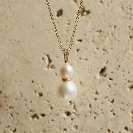 This Eternal Pearl Pendant features both our Broken Bay (NSW) grown 7mm AAA grade Australian Akoya pearl alongside our Cygnet Bay (WA) grown 10.5mm Round A3 grade South Sea pearl complemented by a row of 3 White Diamonds in 18ct gold.