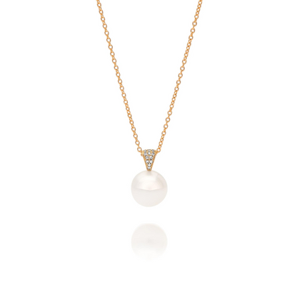 A beautiful Australian South Sea pearl pendant set with a stunning array of white diamonds in yellow gold. 