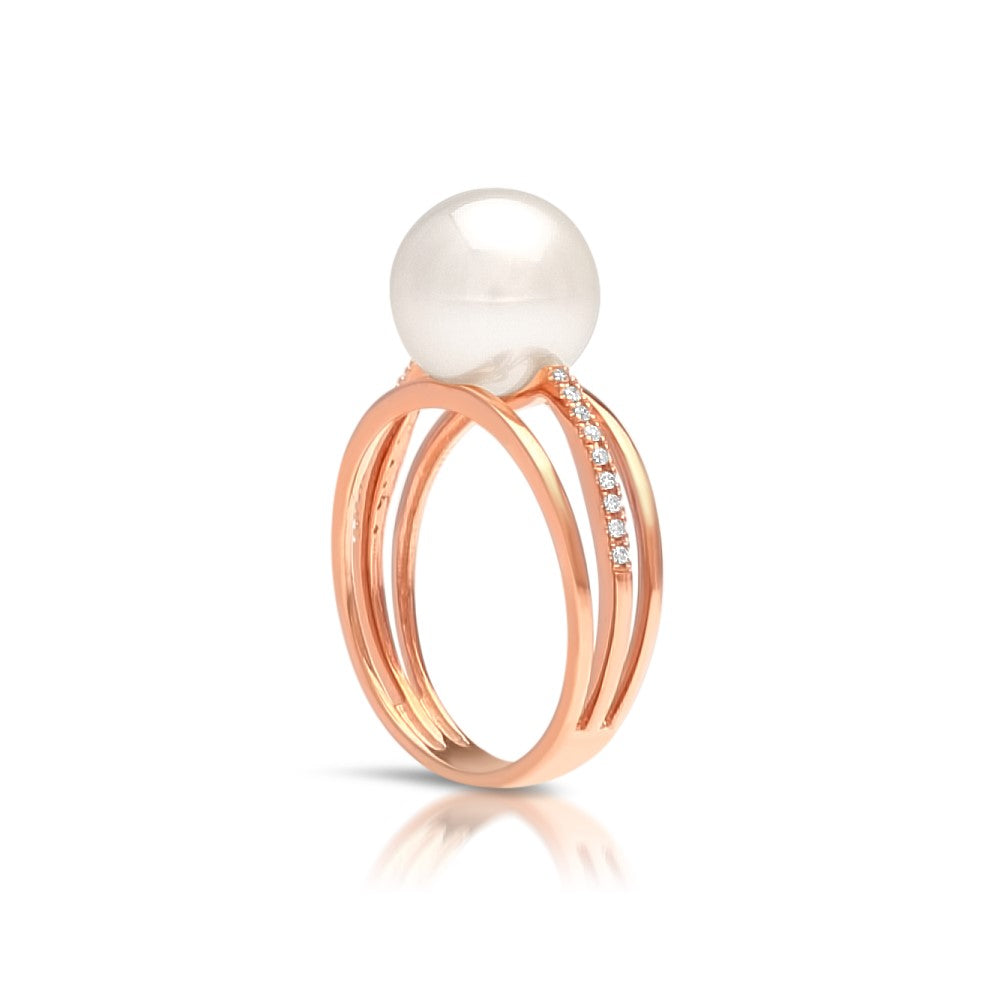 An Eternal Pearl Ring featuring an Australian South Sea pearl set alongside a band of white diamonds in rose gold. 