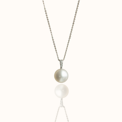 A stunning Australian South Sea pearl set on a white gold pendant, with three white diamonds on the bail of the design.