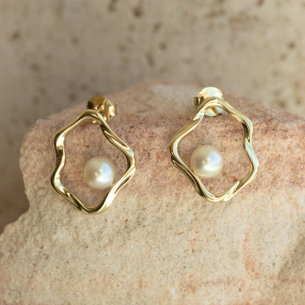 A graceful pair of Flow Pearl Stud Earrings featuring a pair of Broken Bay (NSW) grown 6.5mm AA grade Australian Akoya Pearls set in an organic gold plated sterling silver design.