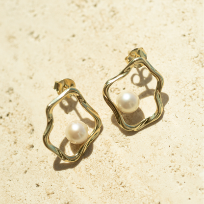 A graceful pair of Flow Pearl Stud Earrings featuring a pair of Broken Bay (NSW) grown 6.5mm AA grade Australian Akoya Pearls set in an organic gold plated sterling silver design.