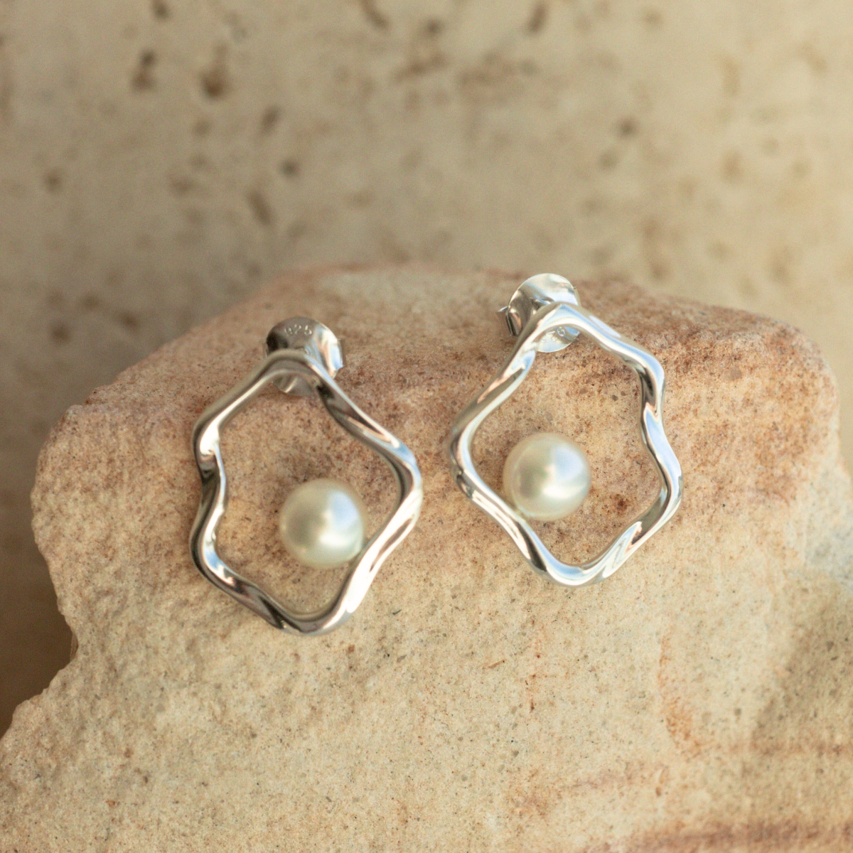 A graceful pair of Flow Pearl Stud Earrings featuring a pair of Broken Bay (NSW) grown 6.5mm AA grade Australian Akoya Pearls set in an organic sterling silver design.