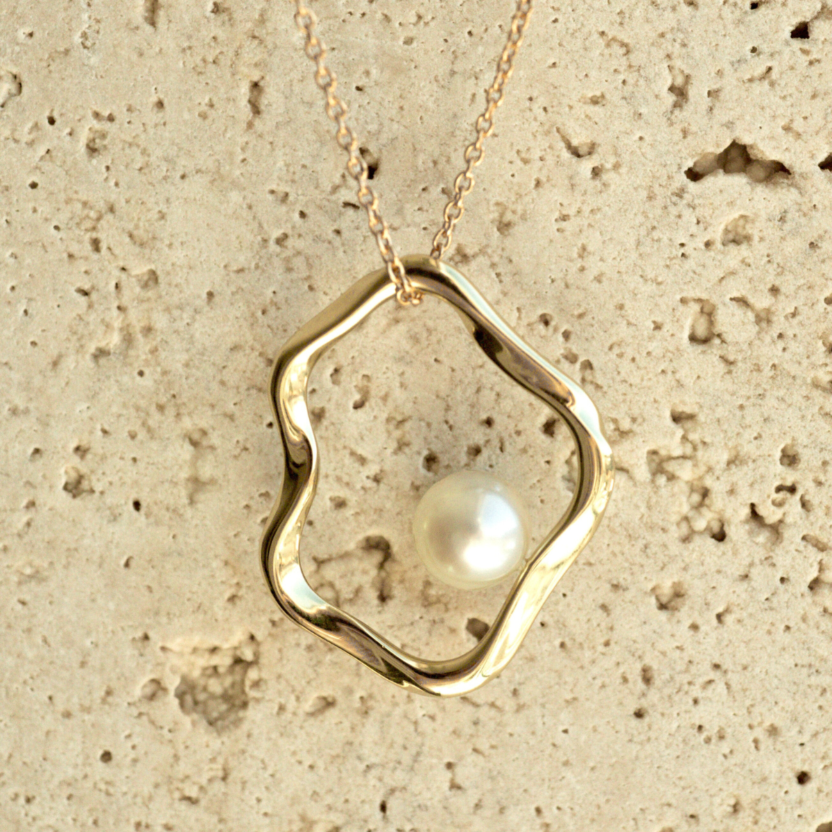 A graceful Flow Pearl Pendant featuring a Broken Bay (NSW) grown 7mm AA grade Australian Akoya Pearl set in an organic gold plated sterling silver design.

