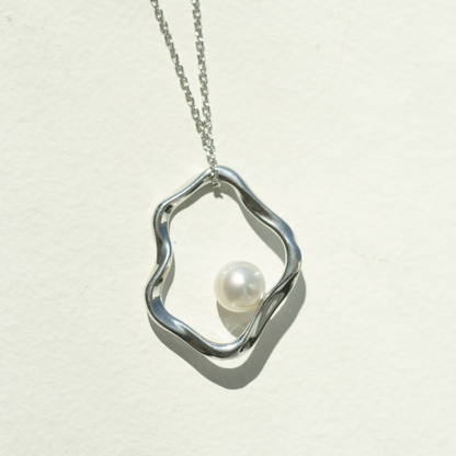 A graceful Flow Pearl Pendant featuring a Broken Bay (NSW) grown 7mm AA grade Australian Akoya Pearl set in an organic sterling silver design.

