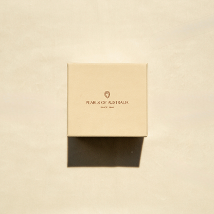 Beige box with 'Pearls of Australia' logo on a beige background