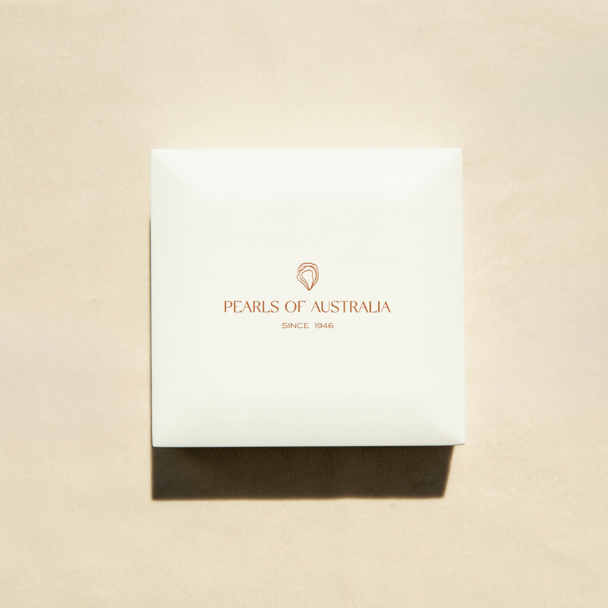 Pearls of Australia high end packaging on a beige background