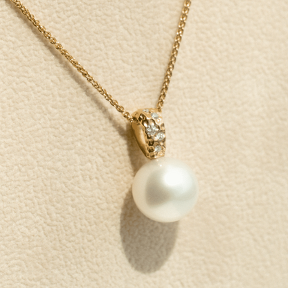 A stunning Australian South Sea pearl set on an Impressions pendant design featuring several white diamonds. 