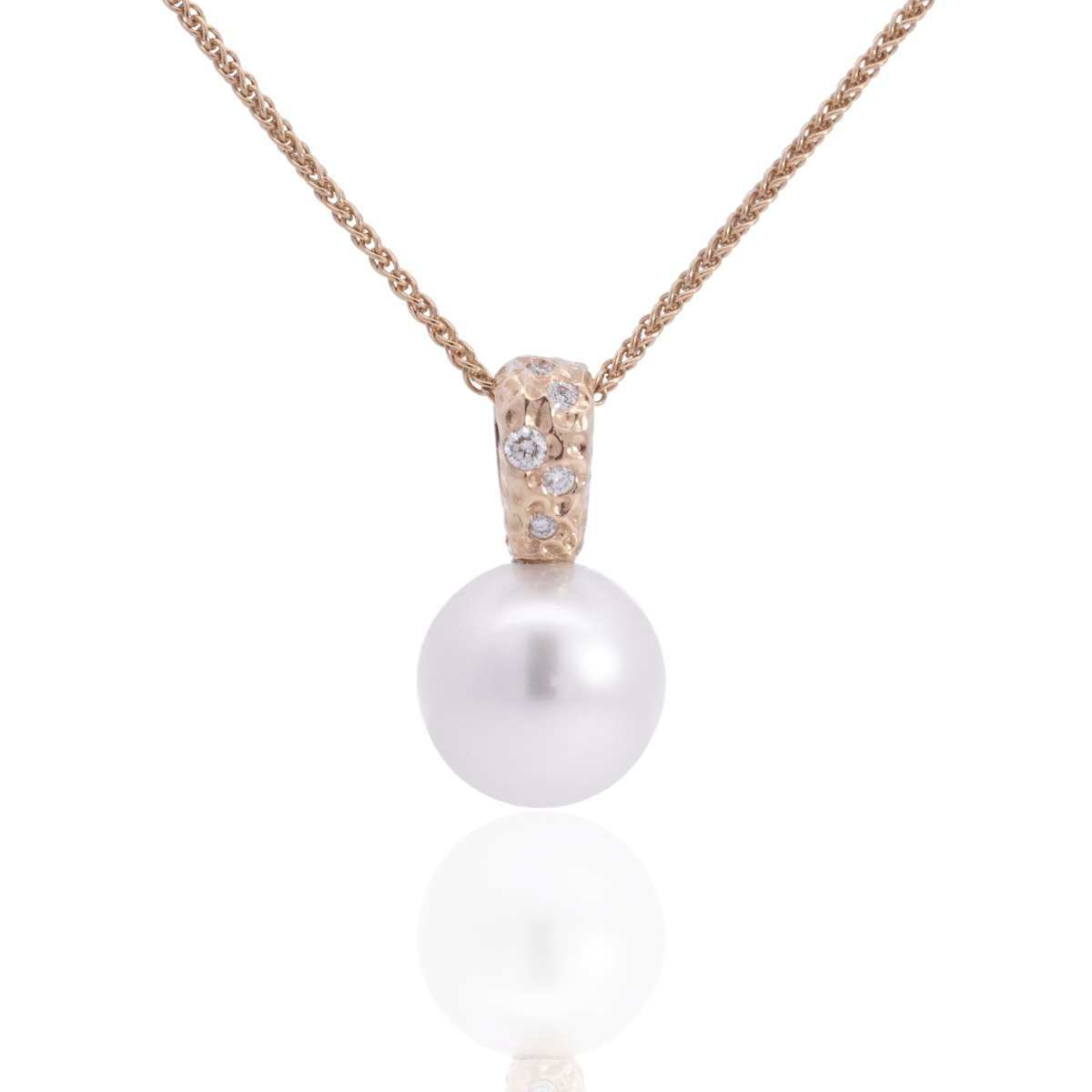 A stunning Australian South Sea pearl set on an Impressions pendant design featuring several white diamonds. 