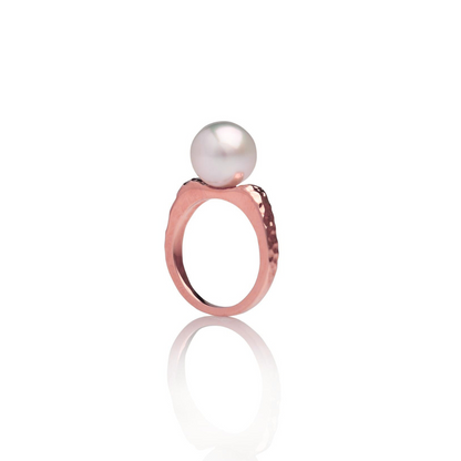 A stunning Australian South Sea pearl set on a hammered rose gold ring design.