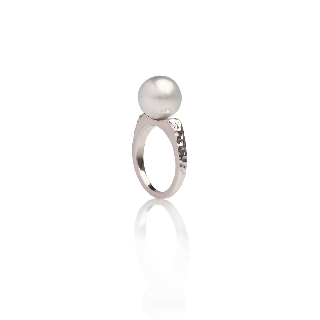 A stunning Australian South Sea pearl set on a hammered white gold ring design.