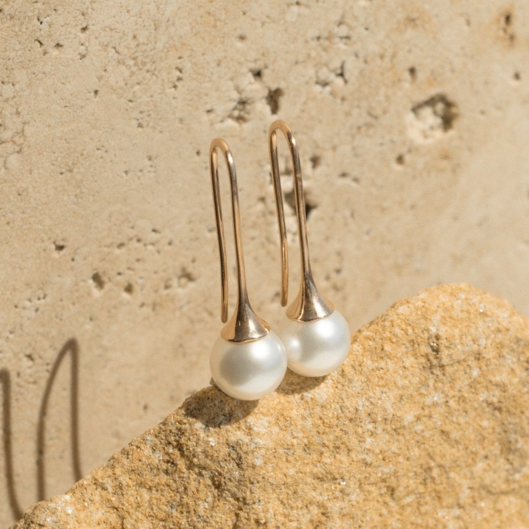 A pair of beautiful Ince Pearl Hook Earrings set in gold.