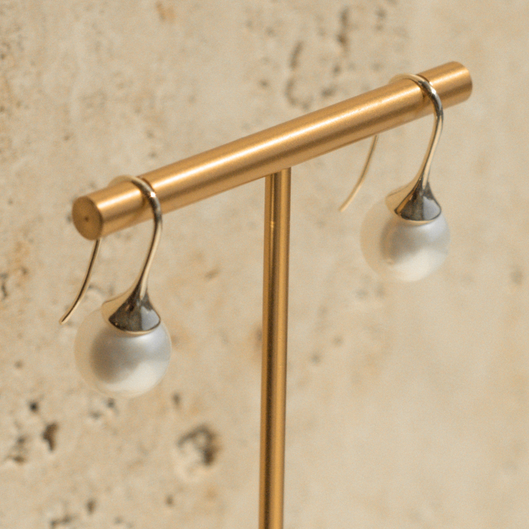 A pair of stunning Australian South Sea pearl hooks set on a solid gold design.