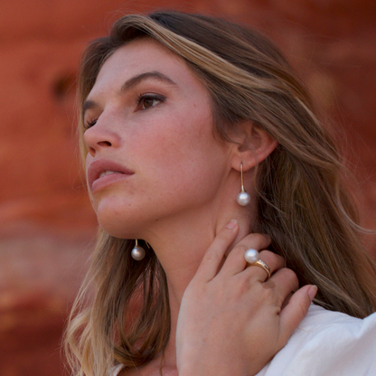 A woman wears her stunning Australian South Sea pearls set on Inca Pearl Long Hooks. 