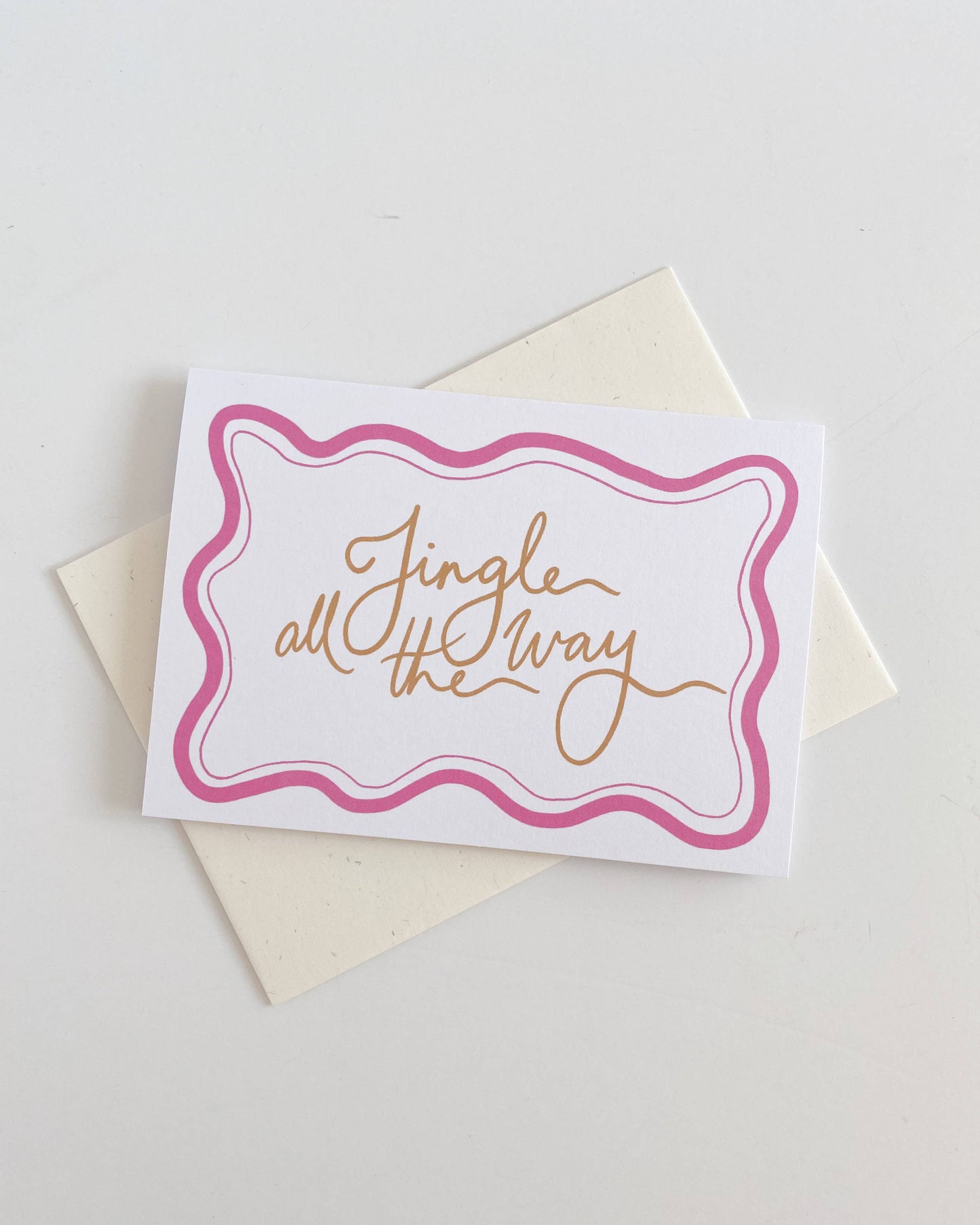 Greeting card with 'Jingle all the way' text on a white background