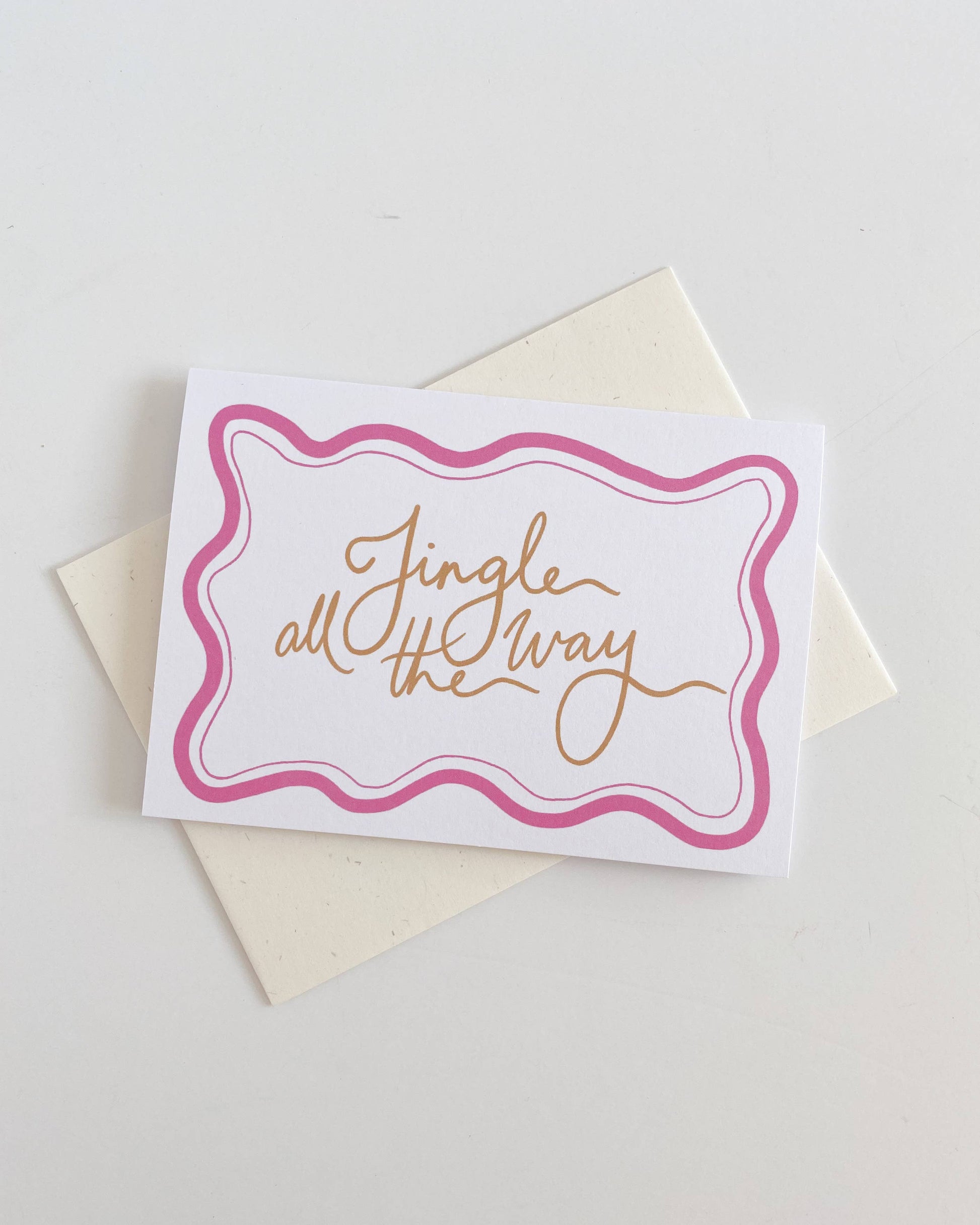Greeting card with 'Jingle all the way' text on a white background