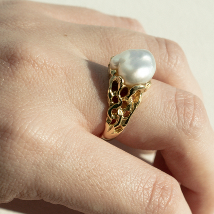 A woman wears her stunning Keepsake Pearl Ring features a Cygnet Bay (WA) grown Australian South Sea Keshi pearl set in a bespoke gold design.