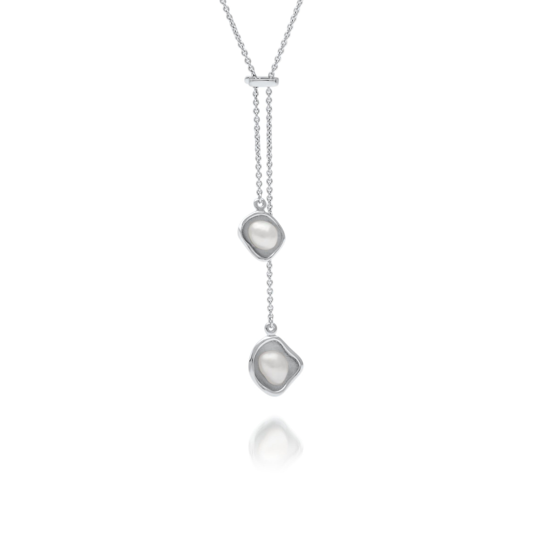 A beautiful Kimberley Lily Lariat featuring two Australian South Sea Keshi pearls set in a unique lily inspired design, on a delicate white gold chain.