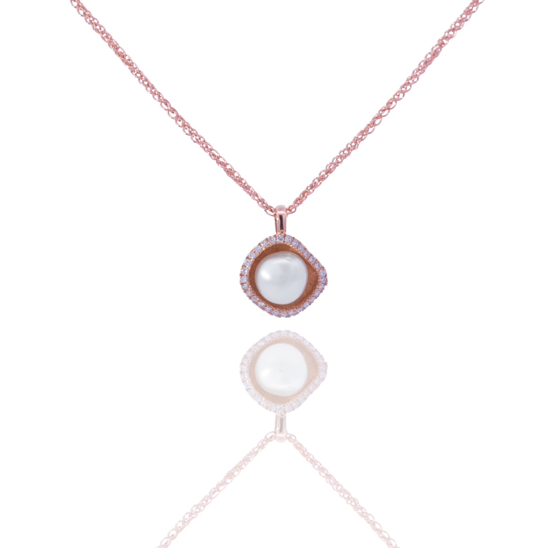 A stunning Kimberley Lily Petite Diamond Pendant set with a halo of diamonds in rose gold.