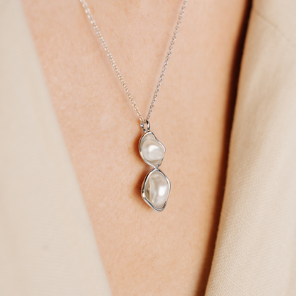 This stunning Kimberley Lily Twin Pearl Pendant features our Cygnet Bay (WA) grown 5-8mm A grade Australian South Sea Keshi Pearls, set in a unique gold design.