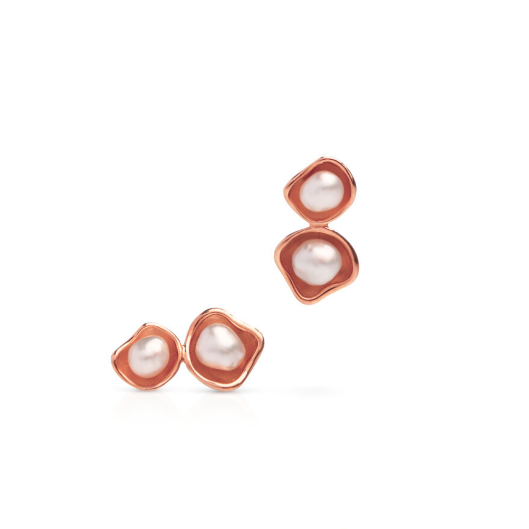 A pair of stunning Kimberley Lily Twin studs featuring Cygnet Bay grown Australian South Sea keshi pearls set in a unique lily inspired design in rose gold.