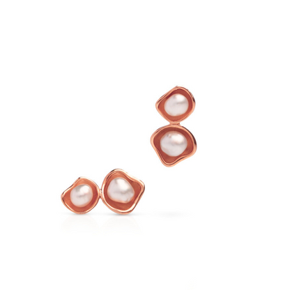 A pair of stunning Kimberley Lily Twin studs featuring Cygnet Bay grown Australian South Sea keshi pearls set in a unique lily inspired design in rose gold.