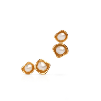 A pair of stunning Kimberley Lily Twin studs featuring Cygnet Bay grown Australian South Sea keshi pearls set in a unique lily inspired design in yellow gold.