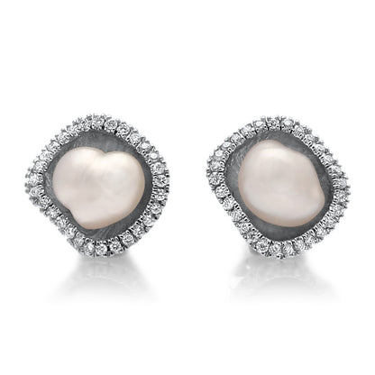 A pair of beautiful Kimberley Lily Diamond Studs featuring a pair of Cygnet Bay grown Australian South Sea Keshi pearls set in a unique lily inspired design, with a halo of sparkling white diamonds in white gold.