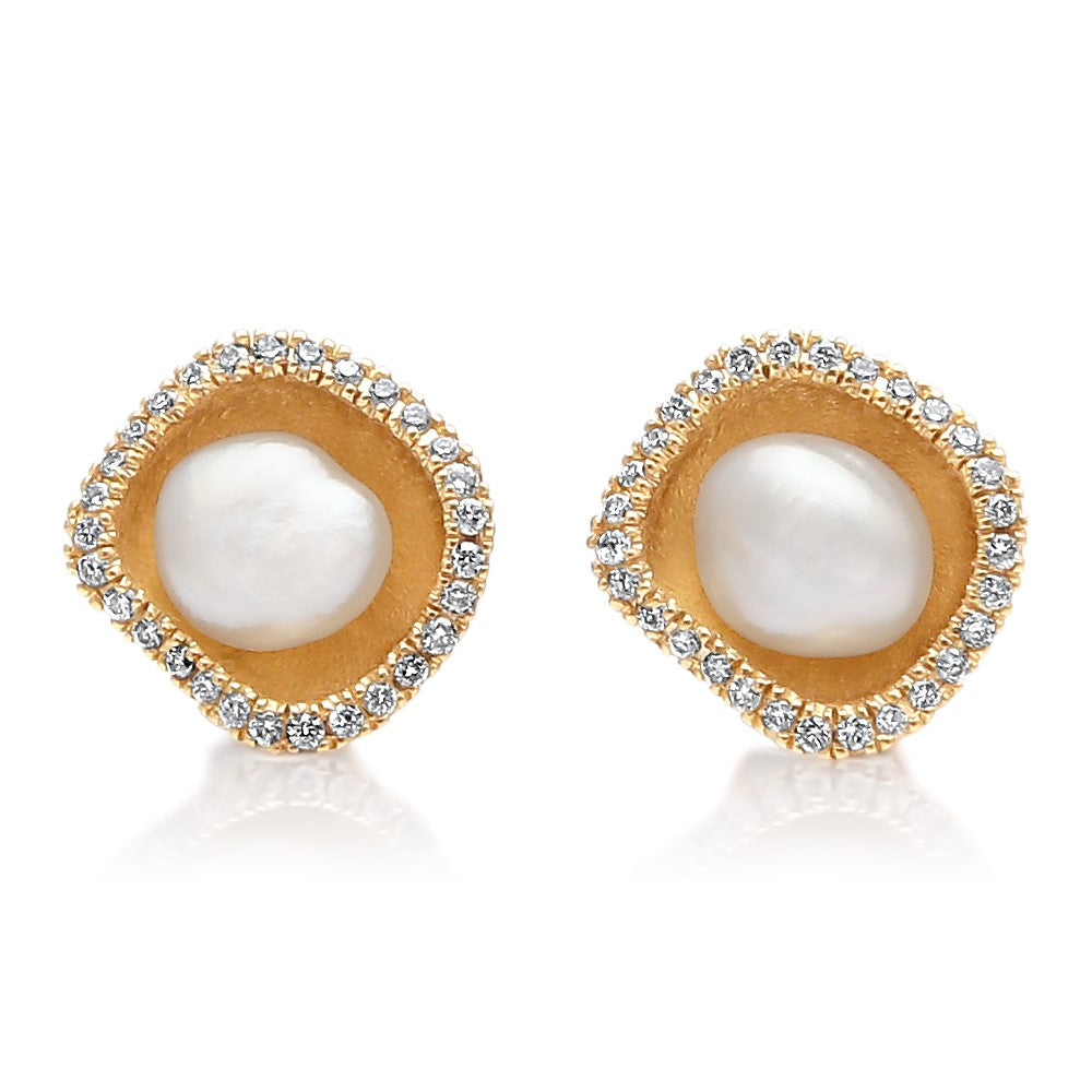 A pair of beautiful Kimberley Lily Diamond Studs featuring a pair of Cygnet Bay grown Australian South Sea Keshi pearls set in a unique lily inspired design, with a halo of sparkling white diamonds in yellow gold.