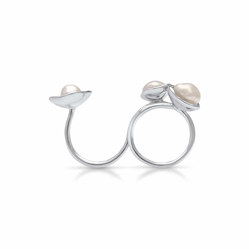 A stunning float ring that features three keshi pearls set in a stunning lily design in white gold.