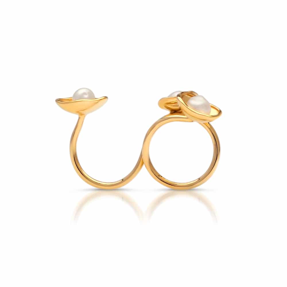 A stunning float ring that features three keshi pearls set in a stunning lily design in yellow gold.