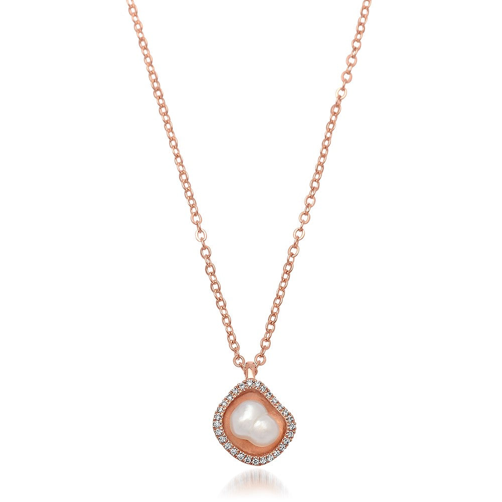 A stunning Kimberley Lily Diamond Pendant featuring an Australian South Sea Keshi pearl set in rose gold with a diamond halo.