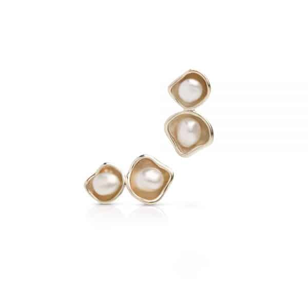 A pair of Kimberley Lily Pearl Twin Studs featuring a Cygnet Bay grown Australian South Sea Keshi pearls set in a twin 
gold.