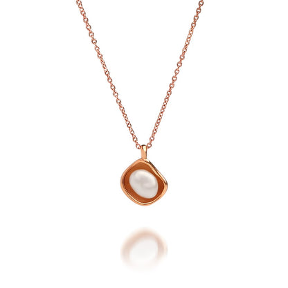 A stunning Kimberley Lily Pearl Pendant featuring an Australian grown Australian Keshi pearl set in a unique lily inspired design in rose gold.