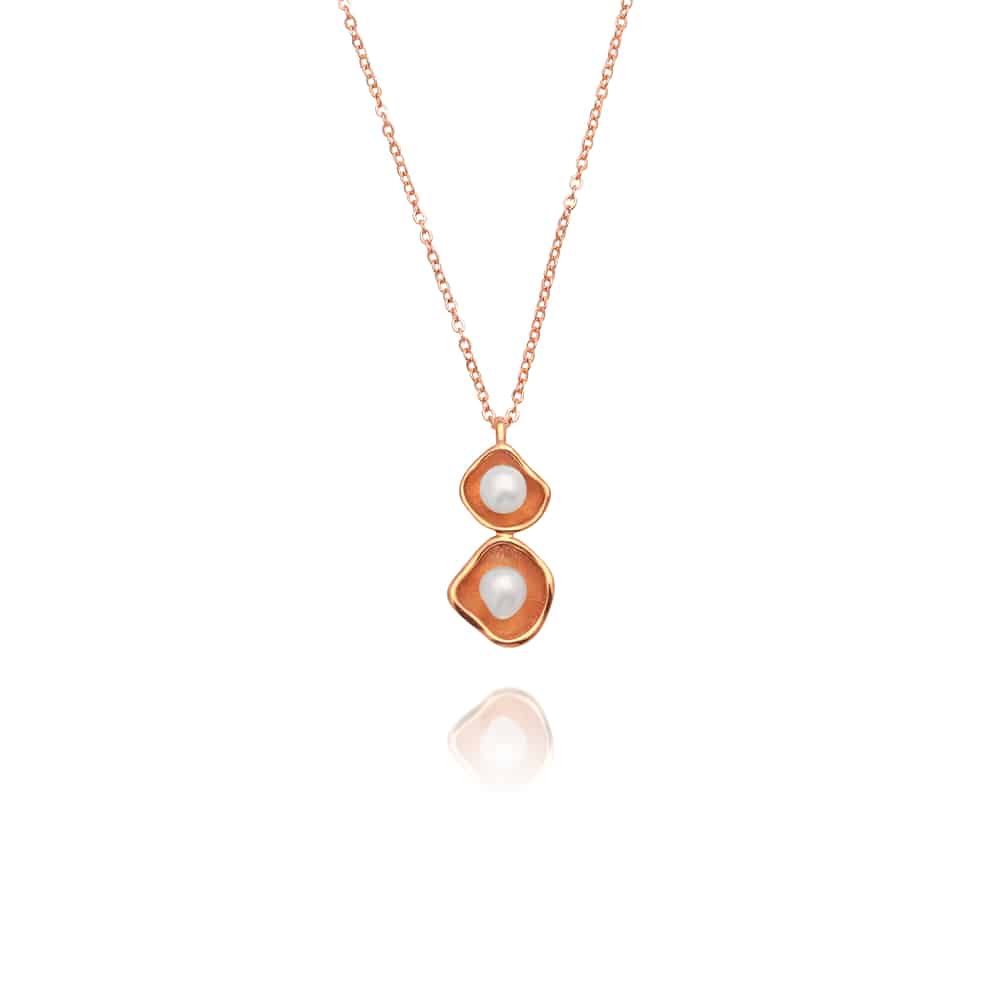 A stunning Kimberley Lily twin pendant featuring a pair of Cygnet Bay grown Australian South Sea keshi pearls set in a unique lily inspired design, in rose gold. 