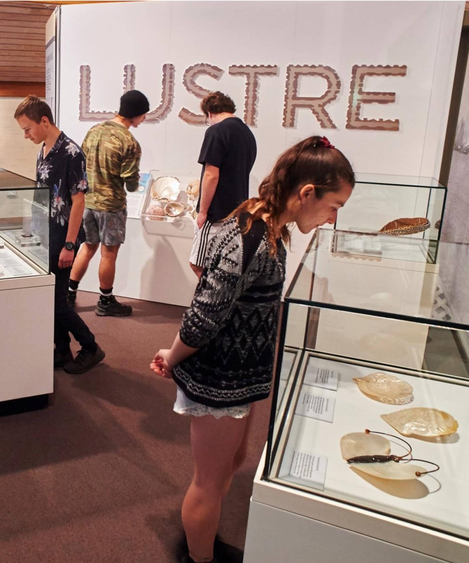 A photo of the Lustre Exhibition, showcasing stunning Mother of Pearl shell and the important history around Mother of Pearl shell in Broome.