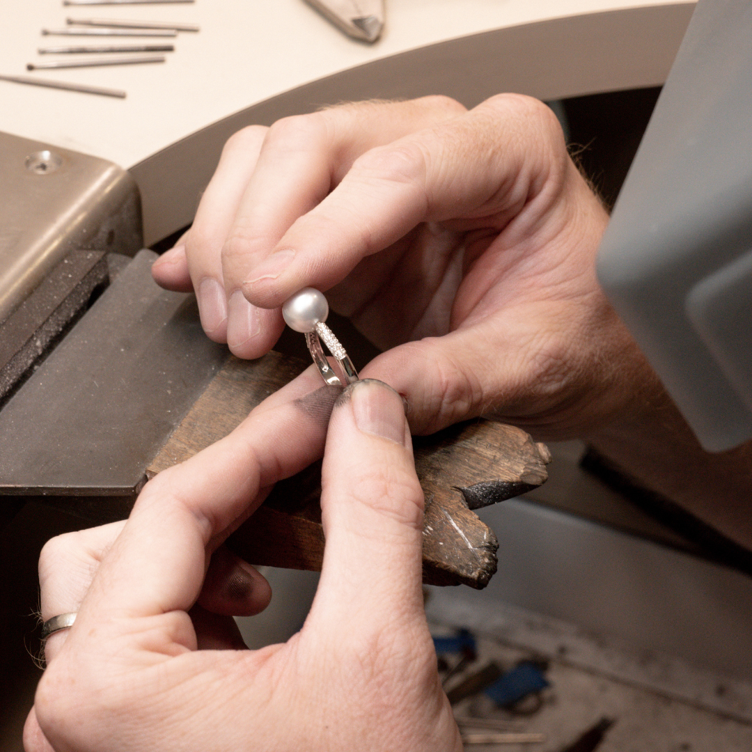 Our jeweller inspects a stunning Australian South Sea pearl ring after being meticulously crafted at our Perth Studio.