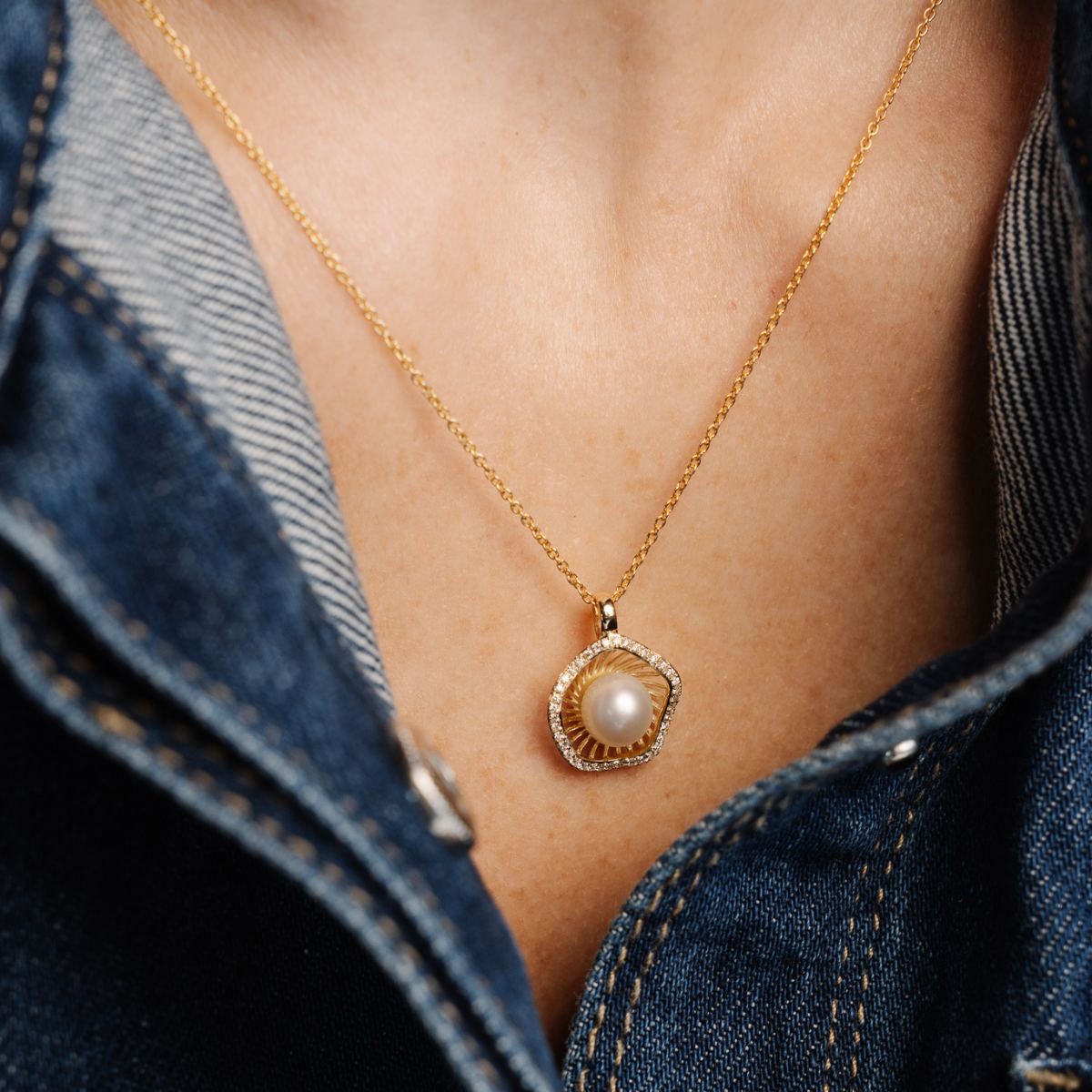 A stunning Mangrove Lily Pearl &amp; Diamond Pendant featuring a Broken Bay (NSW) 7mm AAA grade Australian Akoya pearl complemented by a halo of thirty-eight (38) white diamonds set in 9ct gold.