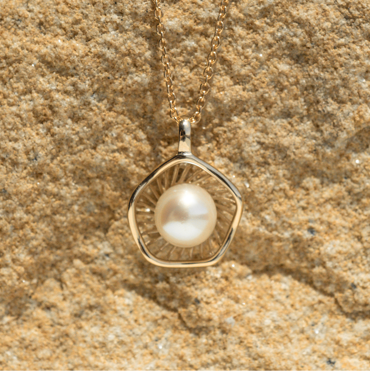 A stunning Mangrove Lily Pearl Pendant featuring a Broken Bay (NSW) 7mm AAA grade Australian Akoya pearl set in 9ct gold. Mirroring the Mangrove Lily, the filigree metalwork featured in the design of this collection evokes the umbrella of petals belonging to this coastal marvel.