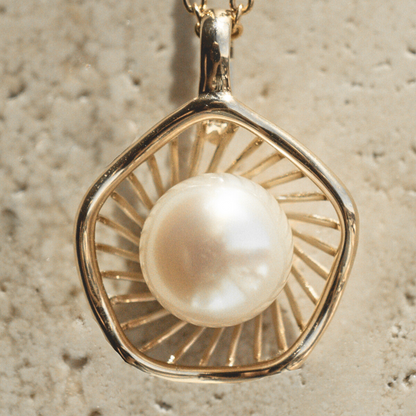 A stunning Mangrove Lily Pearl Pendant featuring a Broken Bay (NSW) 7mm AAA grade Australian Akoya pearl set in 9ct gold. Mirroring the Mangrove Lily, the filigree metalwork featured in the design of this collection evokes the umbrella of petals belonging to this coastal marvel.