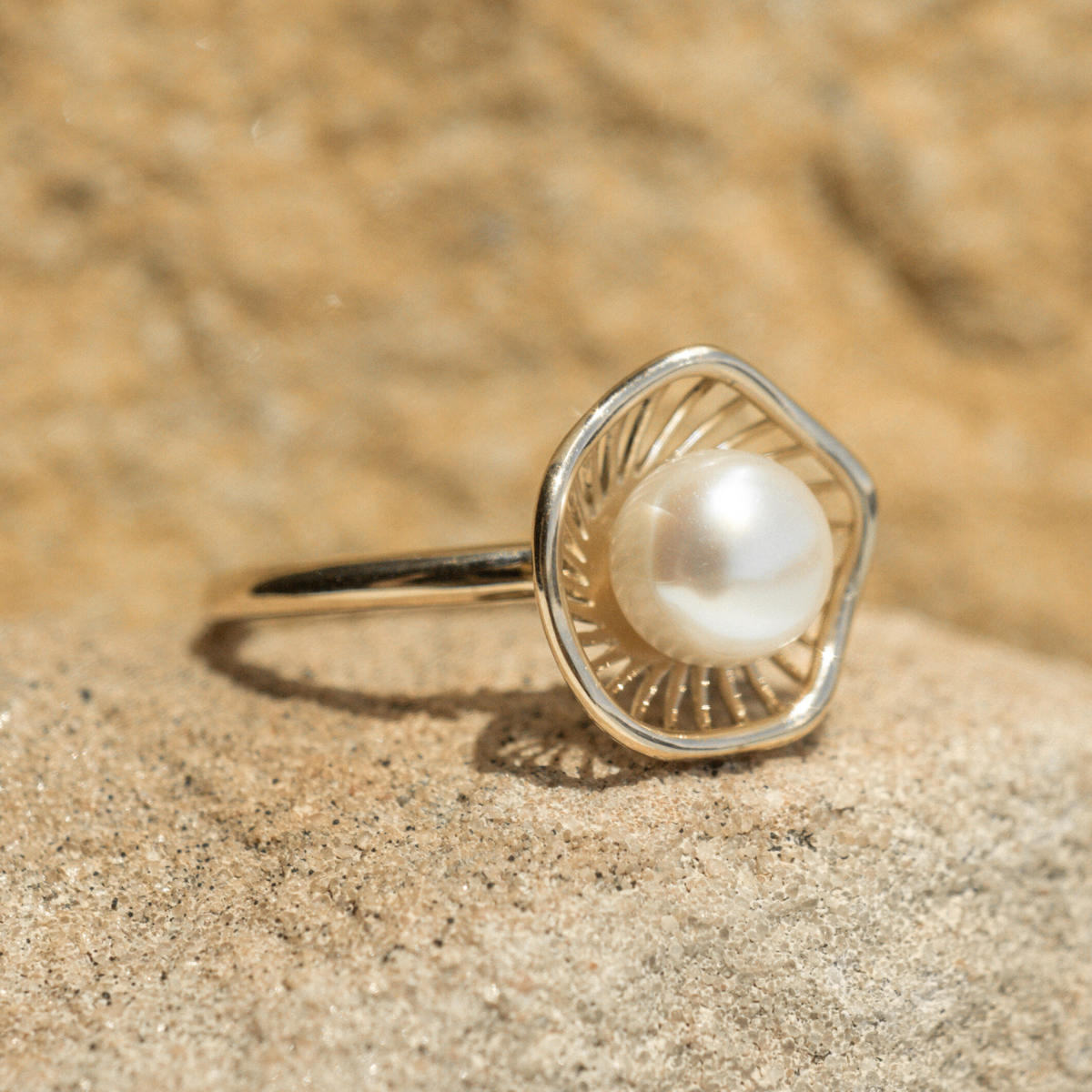 A stunning Mangrove Lily Pearl Ring featuring a Broken Bay (NSW) 7mm AAA grade Australian Akoya pearl set in 9ct gold. Mirroring the Mangrove Lily, the filigree metalwork featured in the design of this collection evokes the umbrella of petals belonging to this coastal marvel.