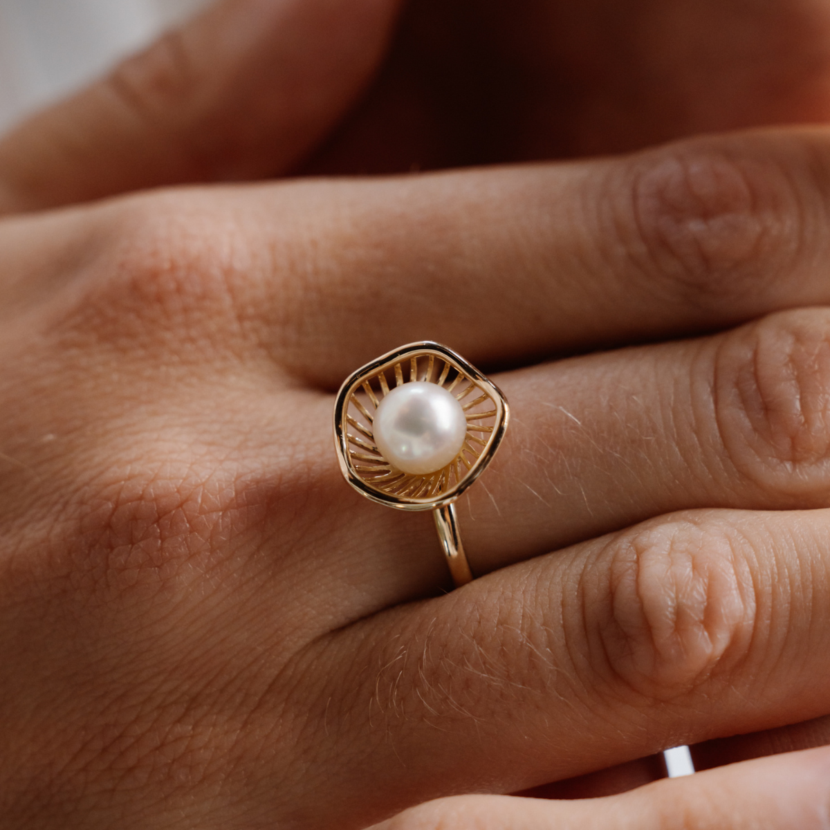 A stunning Mangrove Lily Pearl Ring featuring a Broken Bay (NSW) 7mm AAA grade Australian Akoya pearl set in 9ct gold. Mirroring the Mangrove Lily, the filigree metalwork featured in the design of this collection evokes the umbrella of petals belonging to this coastal marvel.