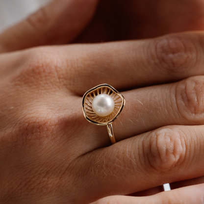 A stunning Mangrove Lily Pearl Ring featuring a Broken Bay (NSW) 7mm AAA grade Australian Akoya pearl set in 9ct gold. Mirroring the Mangrove Lily, the filigree metalwork featured in the design of this collection evokes the umbrella of petals belonging to this coastal marvel.