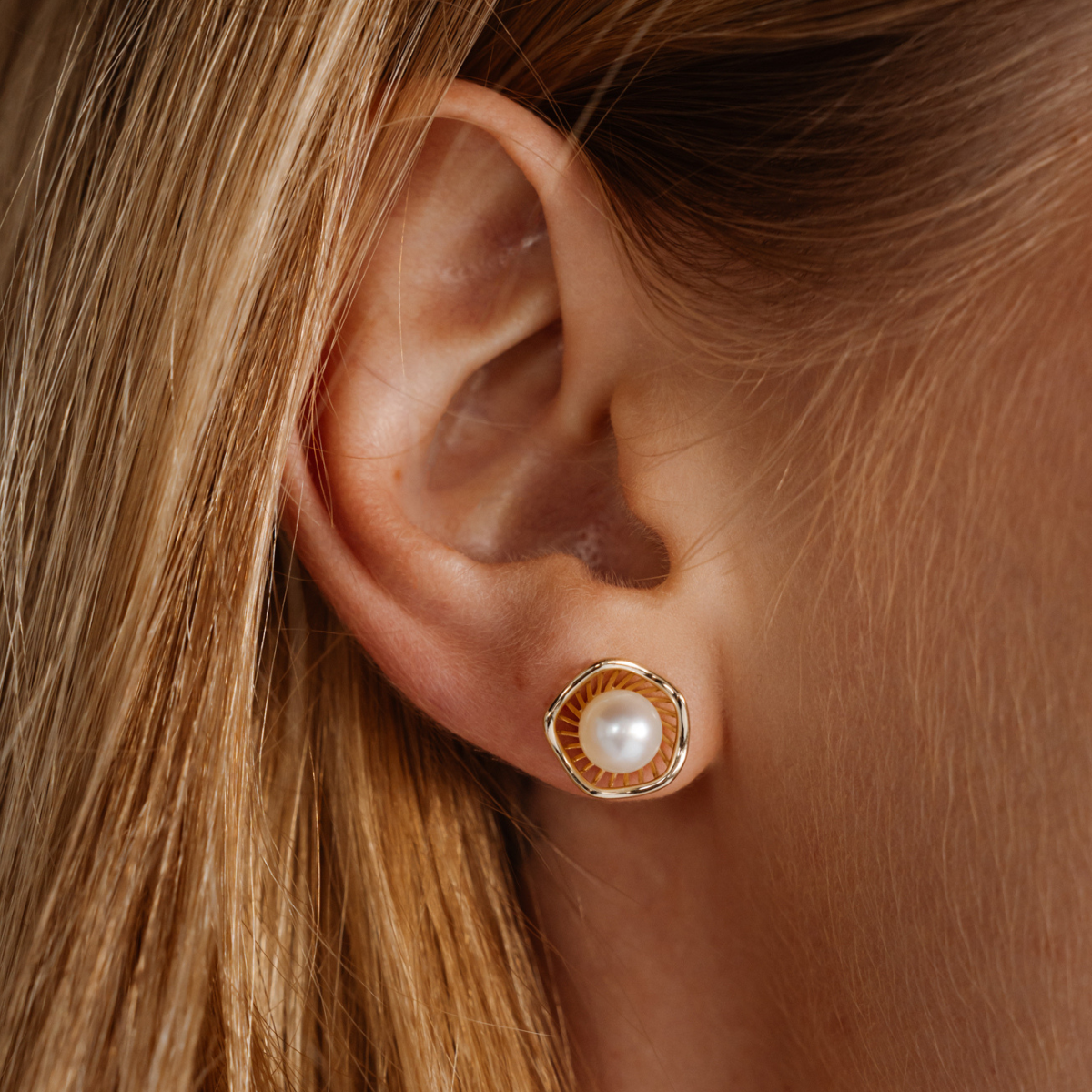 A stunning pair of Mangrove Lily Pearl Studs featuring Broken Bay (NSW) 7mm AAA grade Australian Akoya pearls set in 9ct gold. Mirroring the Mangrove Lily, the filigree metalwork featured in the design of this collection evokes the umbrella of petals belonging to this coastal marvel.