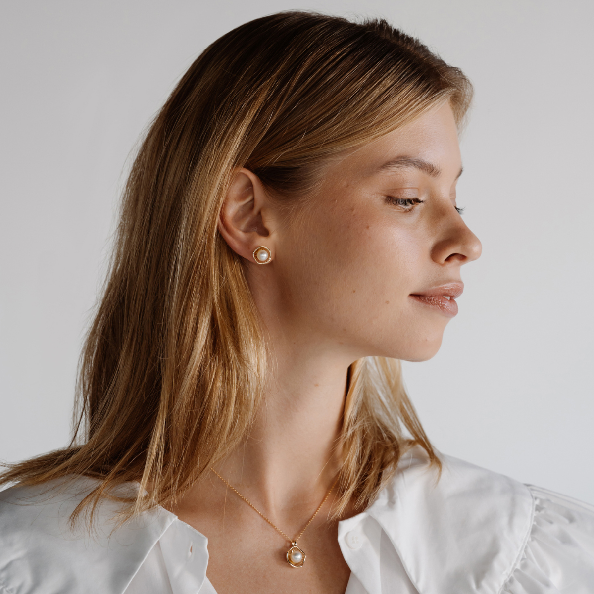 A stunning pair of Mangrove Lily Pearl Studs featuring Broken Bay (NSW) 7mm AAA grade Australian Akoya pearls set in 9ct gold. Mirroring the Mangrove Lily, the filigree metalwork featured in the design of this collection evokes the umbrella of petals belonging to this coastal marvel.