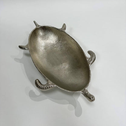 Silver turtle-shaped dish on a white background