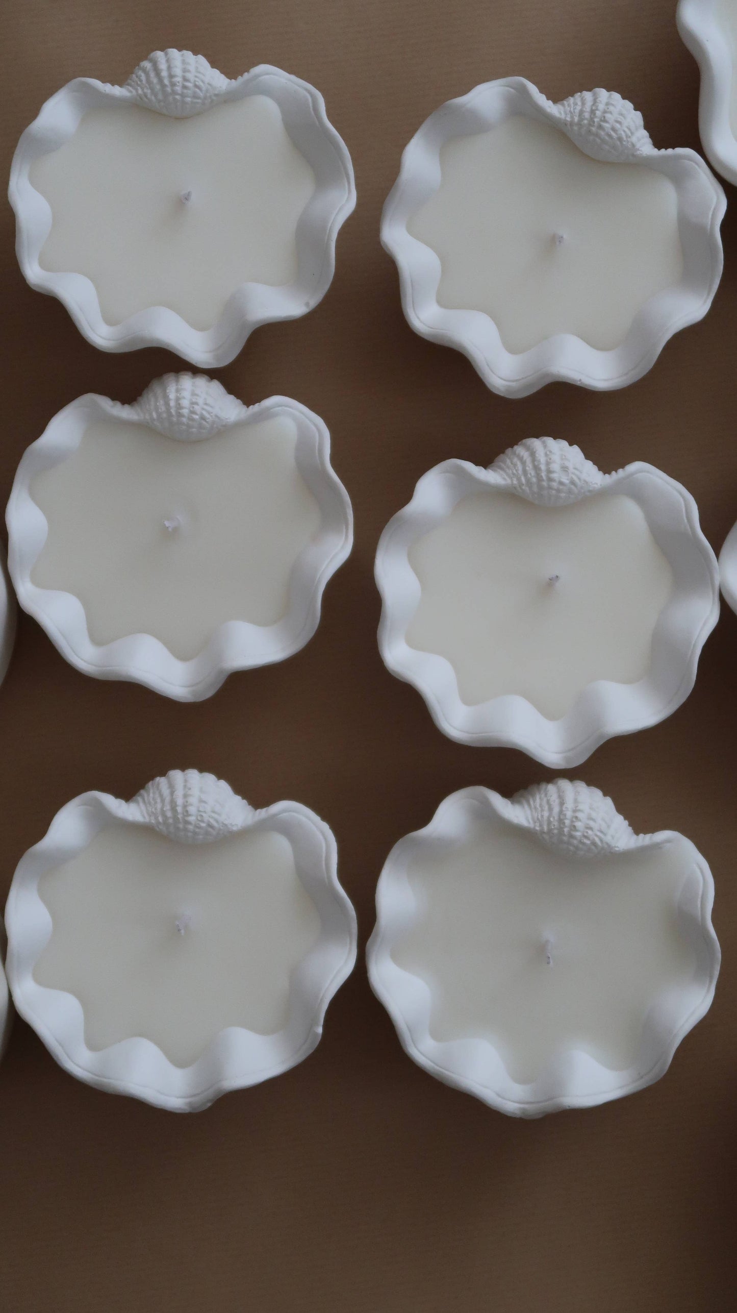 Elevate your ambiance with a Mini Clamshell Candle. Crafted with cruelty-free scents and coconut wax, each candle is meticulously hand-poured to order, ensuring a unique experience for every customer. Each jar is individually hand poured.  


